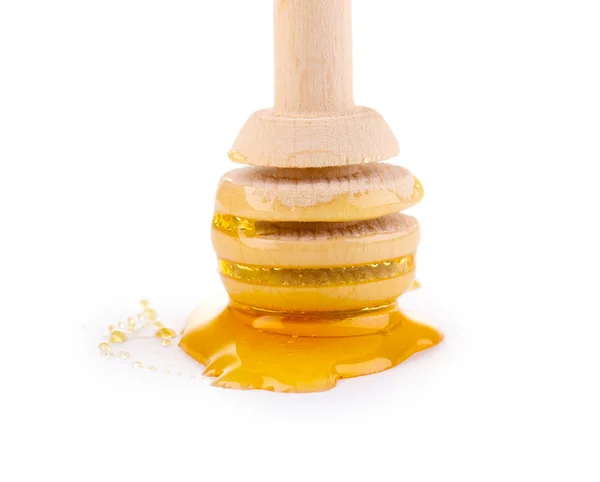 Sweet honey on drizzler isolated on white — Stock Photo, Image