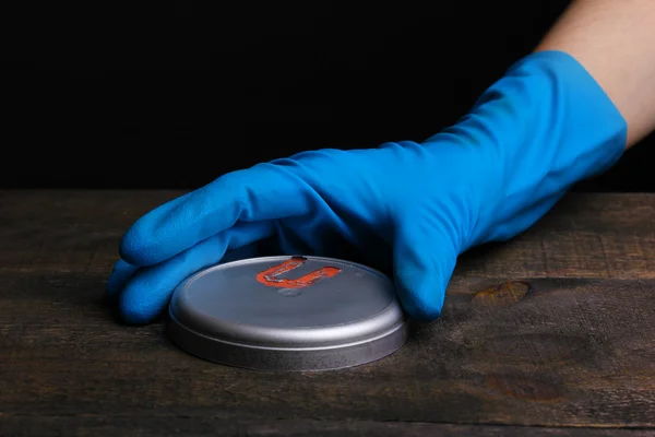 Uranium on wooden table isolated on black — Stock Photo, Image