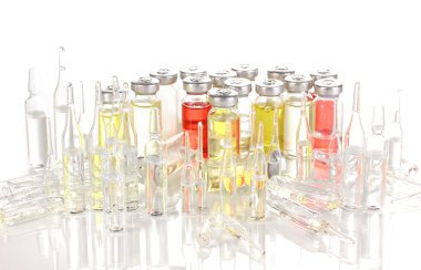 Tablets and ampoules isolated on white clipart