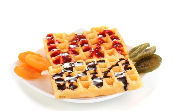 Sweet waffles with jam and chocolate on plate isolated on white — Stock Photo, Image