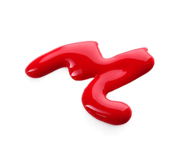 Krople czerwony lakier do paznokci na białym tle — Zdjęcie stockowe