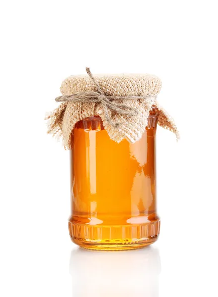 Söt honung i burk isolerad på vit — Stockfoto