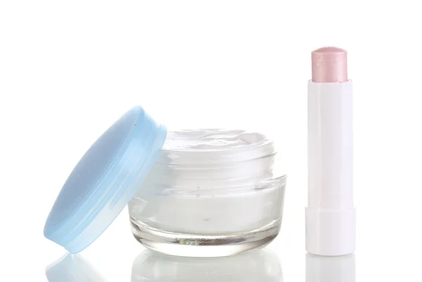 Lápiz labial higiénico y crema hidratante aislados en blanco —  Fotos de Stock