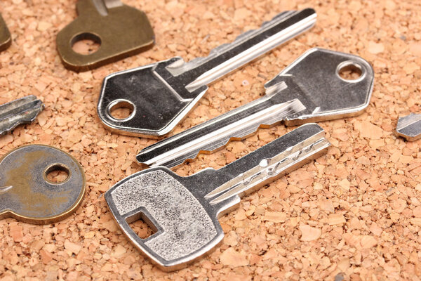 Keys on cork background