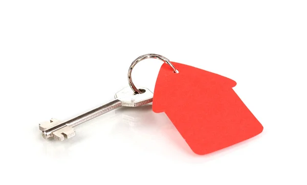 Key with house-shaped charm isolated on white — Stock Photo, Image