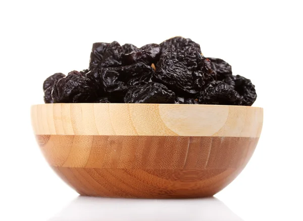 stock image Yummy dried plums in wooden bowl isolated on white