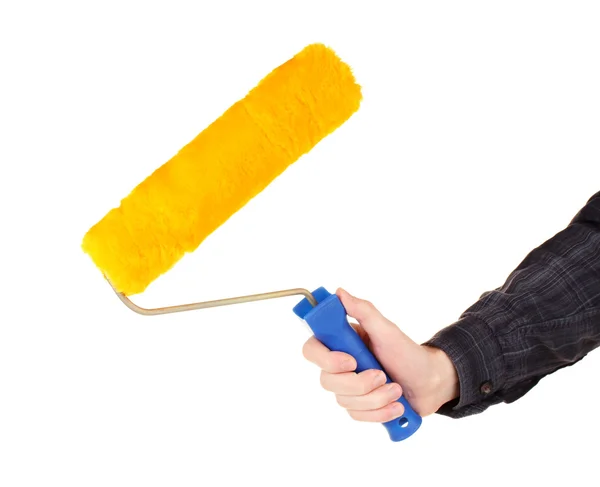 Bright paint roller in hand isolated on white — Stock Photo, Image