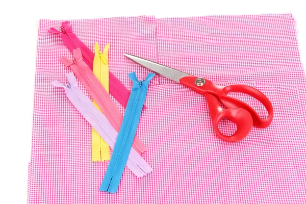 Scissors and zips on fabric isolated on white — Stock Photo, Image