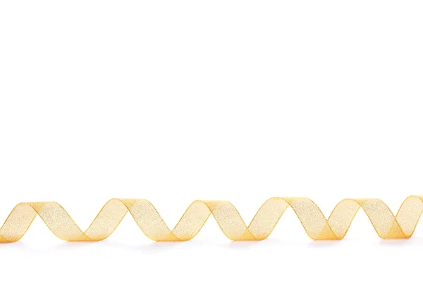 Krásná zlatá stuha izolovaných na bílém — Stock fotografie