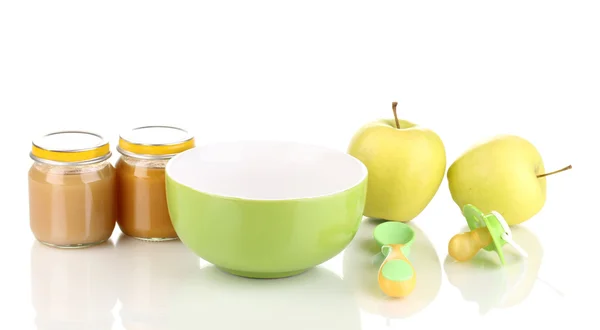 Jars of baby puree with plate, spoon and apples isolated on white — Stock Photo, Image