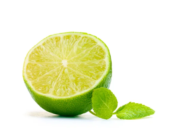 stock image Fresh half lime with mint isolated on white