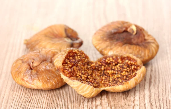 Delicious dried figs on wooden background — Stock Photo, Image