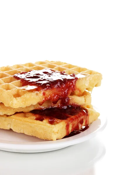 Tasty waffles with jam on plate close-up isolated on white — Stock Photo, Image