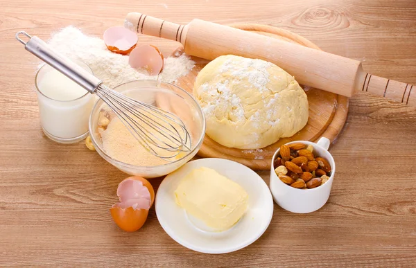 Ingredients for the dough wooden table — Stock Photo, Image