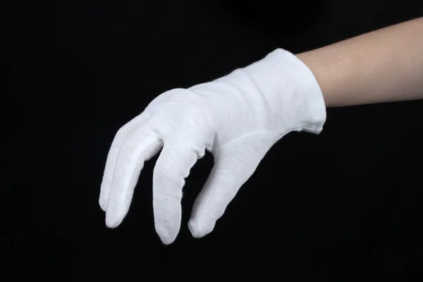 Doek handschoen op hand op zwarte achtergrond — Stockfoto