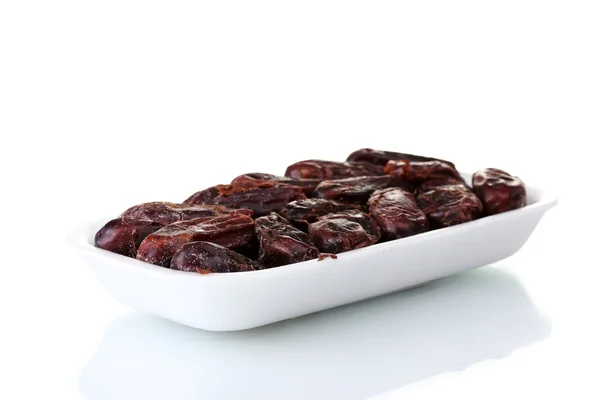 Delicious dried dates in packaging isolated on white — Stock Photo, Image