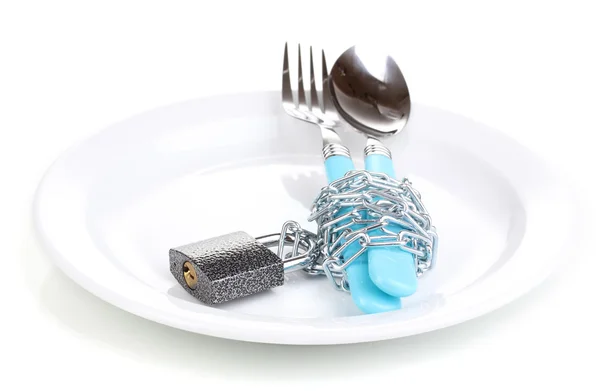 stock image Fork and spoon with chain and padlock on plate isolated on white