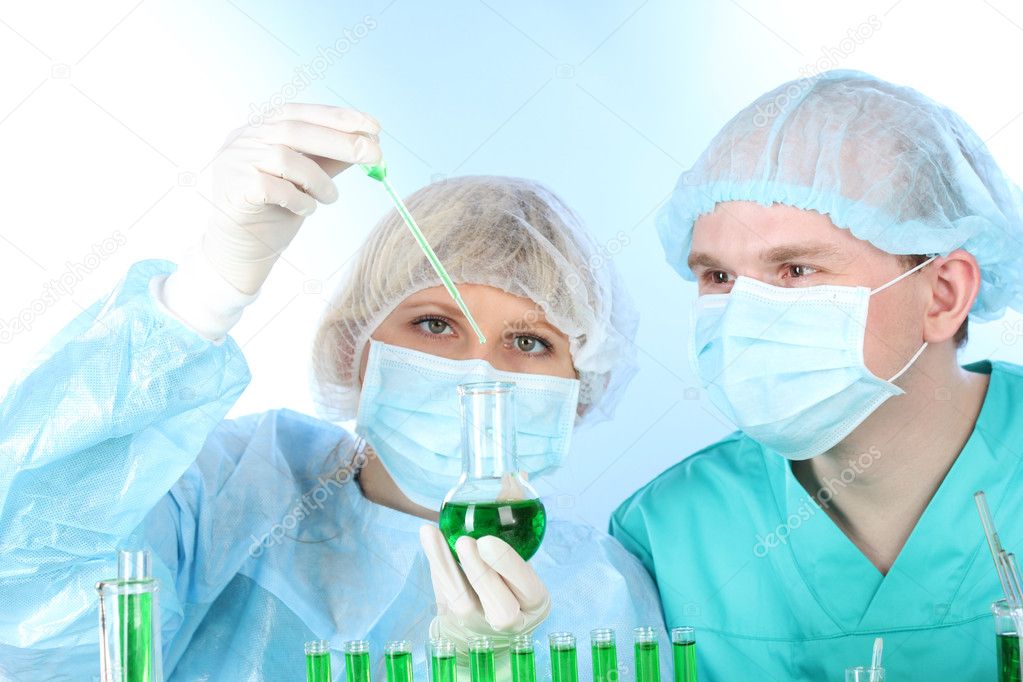Two scientists working in chemistry laboratory
