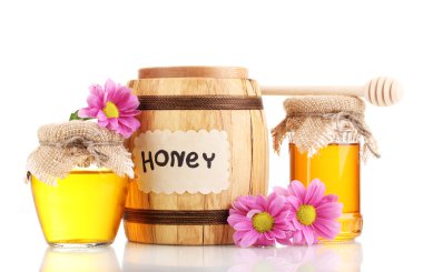 Sweet honey in barrel and jars with drizzler isolated on white clipart