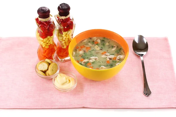 Tasty soup on pink tablecloth isolated on white — Stock Photo, Image