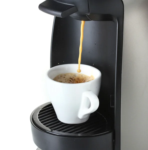 Espresso machine pouring coffee in cup isolated on white — Stock Photo, Image
