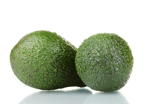 Due frutti di avocado maturi isolati su bianco — Foto Stock