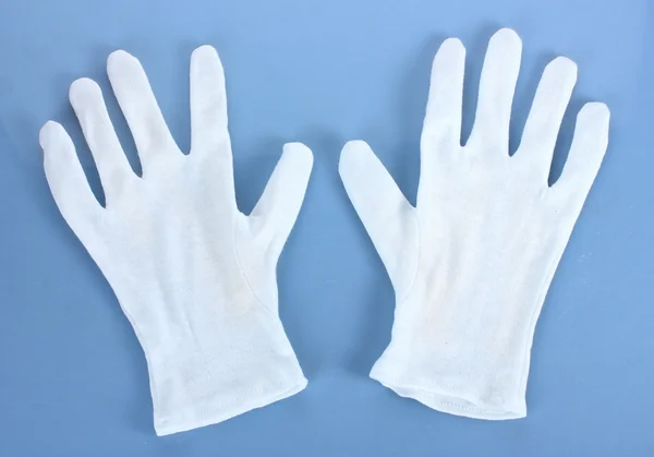 青色の背景に布製の手袋 — ストック写真