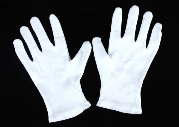 Cloth gloves on black background — Stock Photo, Image