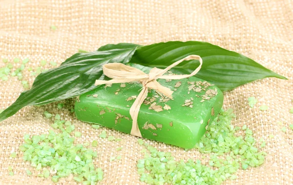 Hand-made herbal soap on sackcloth — Stock Photo, Image