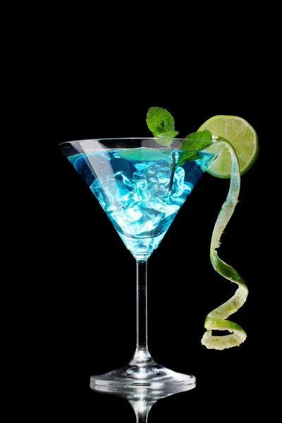 Blue cocktail in glass on black background — Stock Photo, Image