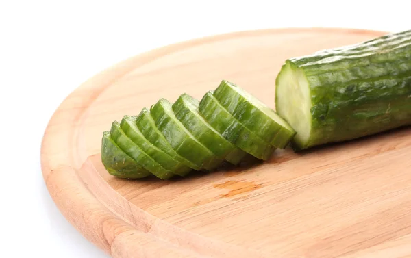 Long cucumber on wooden cutting board isolated on white — Stock Photo, Image
