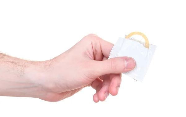Mano sosteniendo un condón aislado en blanco — Foto de Stock