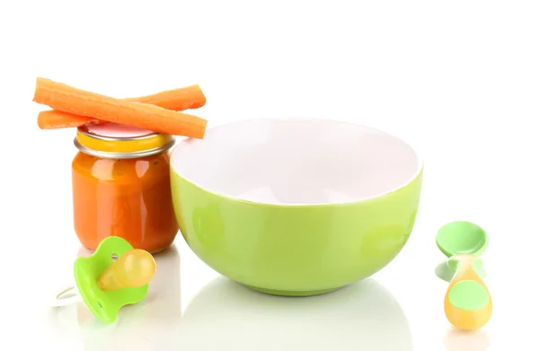 Jars of baby puree with plate, spoon and carrots isolated on white — Stock Photo, Image