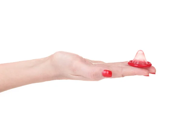 Ruka držící kondom izolované na bílém — Stock fotografie