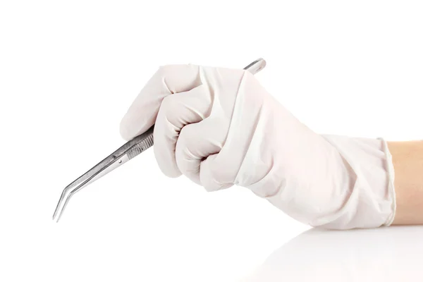 Medical tweezers in hand isolated on white — Stock Photo, Image