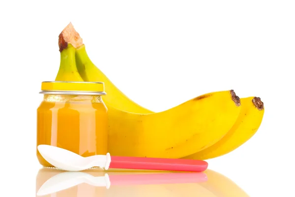 Tarro de puré de bebé con plátanos y cuchara aislada en blanco —  Fotos de Stock
