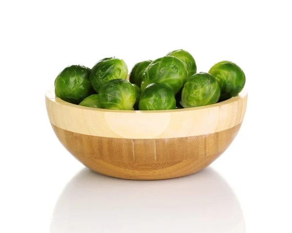 stock image Brussels sprouts in wooden bowl isolated on white