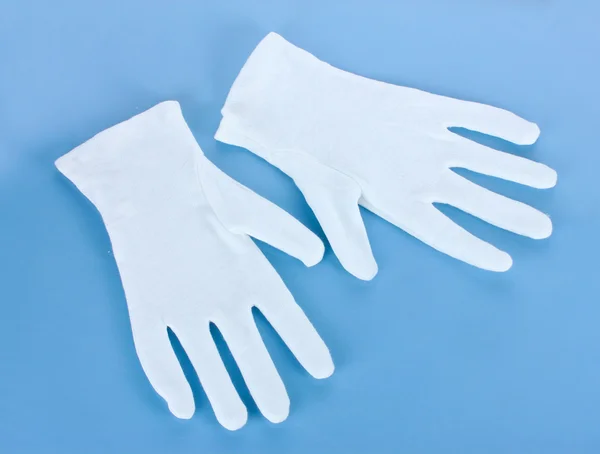 Stock image Cloth gloves on blue background