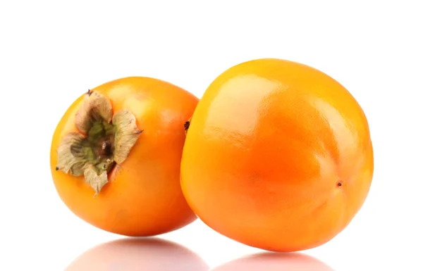 Dwa apetyczne persimmons na białym tle — Zdjęcie stockowe