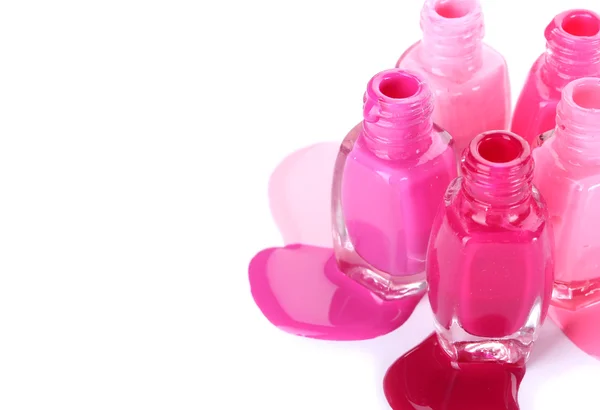 Open bottles with bright nail polish isolated on white — Stock Photo, Image
