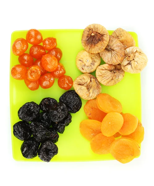 Läcker torkad frukt på plattan isolerad på vit — Stockfoto