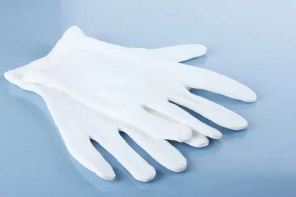 stock image Cloth gloves on blue background