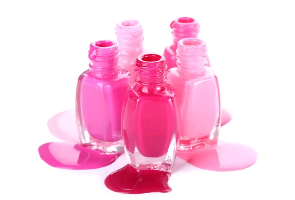 Open bottles with bright nail polish isolated on white — Stock Photo, Image