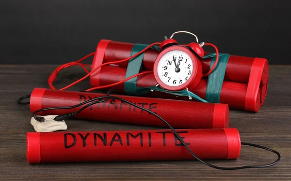 stock image Timebomb made of dynamite on wooden table on grey background