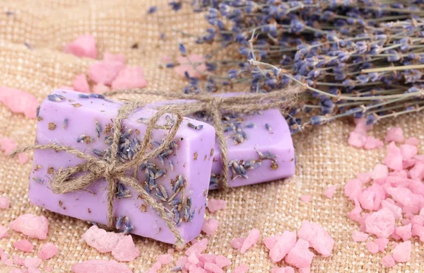 Hand-made lavender soaps on sackcloth — Stock Photo, Image