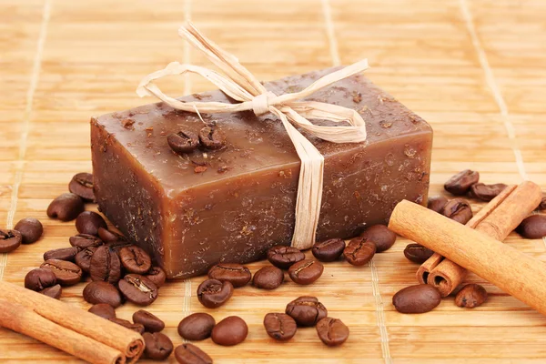 Hand-made soap on wooden mat — Stock Photo, Image