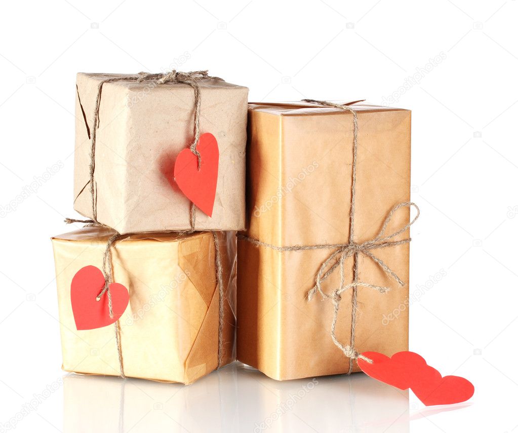 Three parcels with blank heart-shaped labels isolated on white