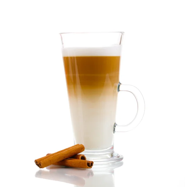 Fragrant сoffee latte in glass cup and cinnamon isolated on white — Stock Photo, Image