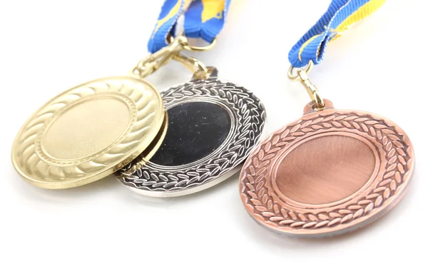Tři medaile izolovaných na bílém — Stock fotografie