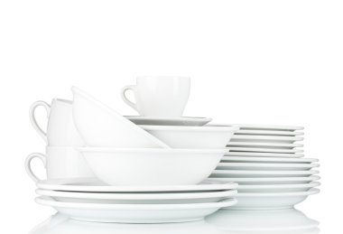 Empty bowls, plates and cups on gray background clipart